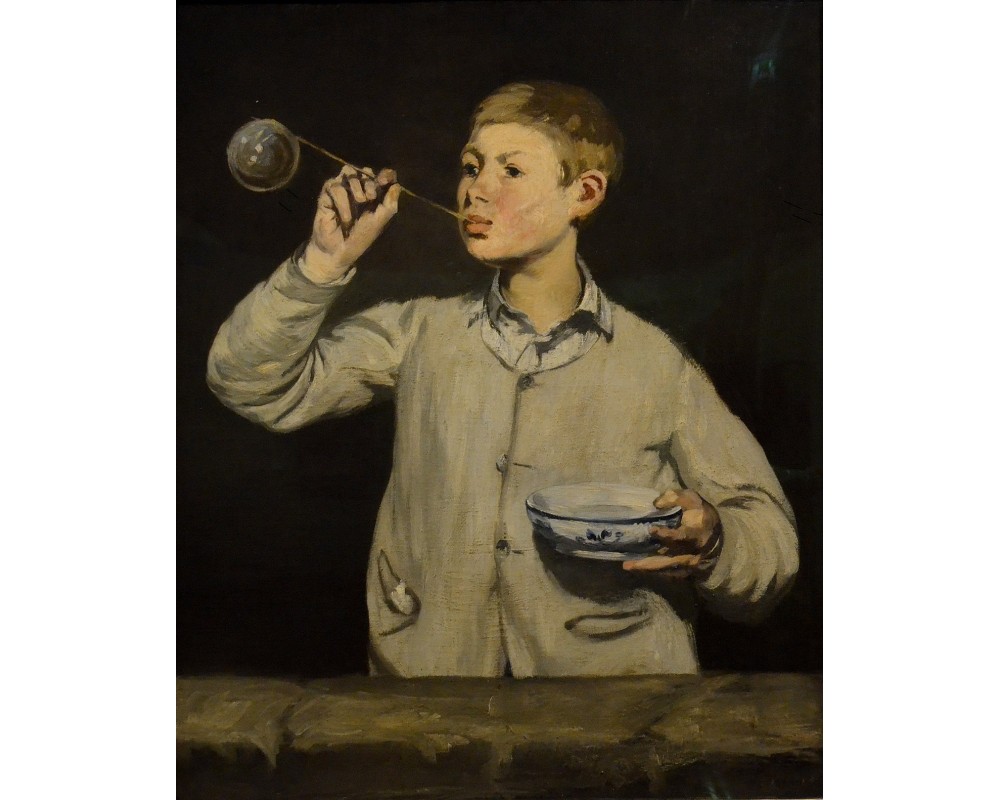 Boy blowing bubbles